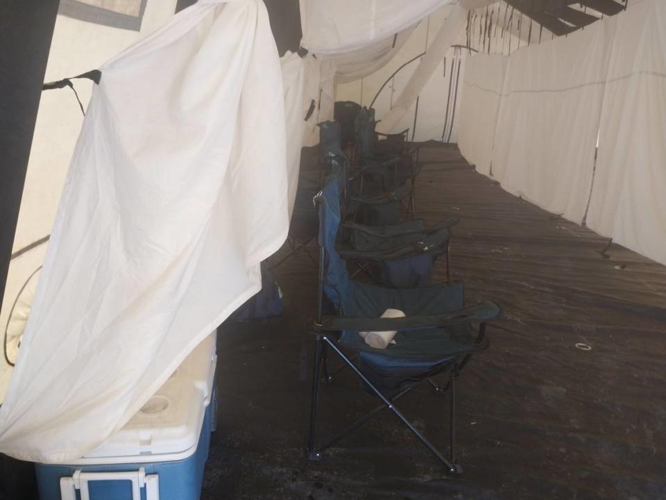 Sedgwick County Fire District 1 has set up tents to house resting firefighters combatting the fire at Evergreen Recycle in Park City. The tents contain fans and coolers with gatorade and water.