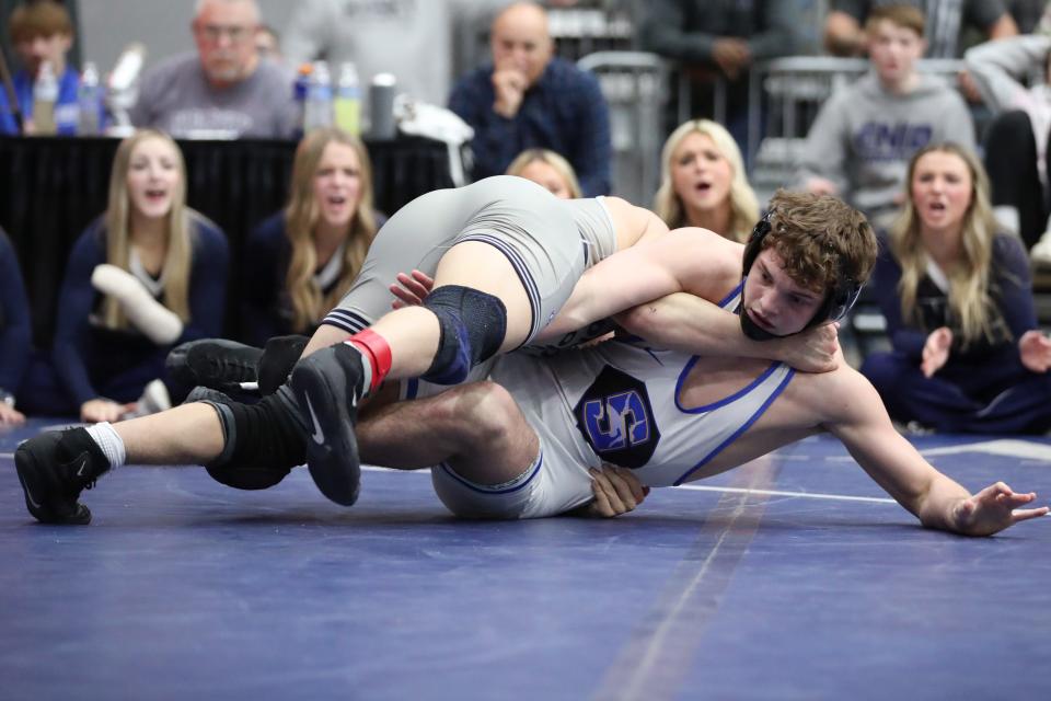 Landyn Sommer of Stillwater, right, wrestles Edmond North's Jude Randall in the Class 6A 165-pound patch during the dual state wrestling tournament finals at Stride Bank Center in Enid, Okla., Saturday, Feb. 11, 2023. 