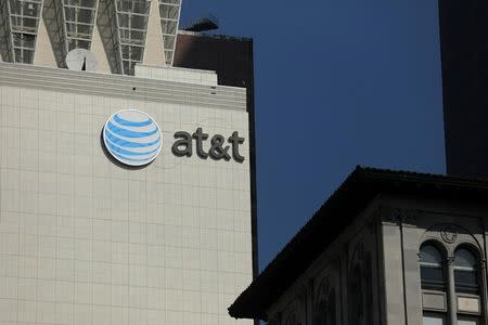 The AT&T logo is pictures on a building in Los Angeles, California, U.S. August 10, 2017. REUTERS/Mike Blake