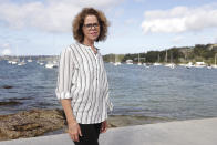 Donna Burton poses for a photo near her home in Sydney on Oct. 20, 2020. Burton had reached Sydney Airport before she was advised that Border Force had denied her an exemption to fly to London for her only daughter’s wedding in July. She had made a second application for a travel exemption after the first was rejected because of a lack of supporting documentation. (AP Photo/Rick Rycroft)