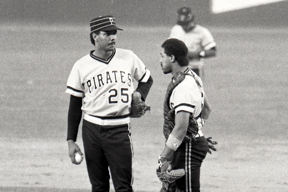 FILE - Pittsburgh Pirates rookie pitcher José DeLeón, left, is consoled by catcher Tony Peña after the New York Mets broke up a no-hitter with one out in the ninth inning of a baseball game, July 31, 1983, in New York. DeLeón, a major league pitcher for 13 seasons who led the National League in strikeouts for the St. Louis Cardinals in 1989, he died Sunday evening, Feb. 25, 2024, at a hospital in Santo Domingo, Dominican Republic. He was 63. (AP Photo/Ray Stubblebine, File)
