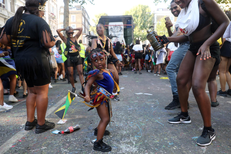 A child reveller dances, holding the Jamaican flag at the Notting Hill Carnival in London, Britain August 25, 2019. (Photo: Simon Dawson/Reuters)