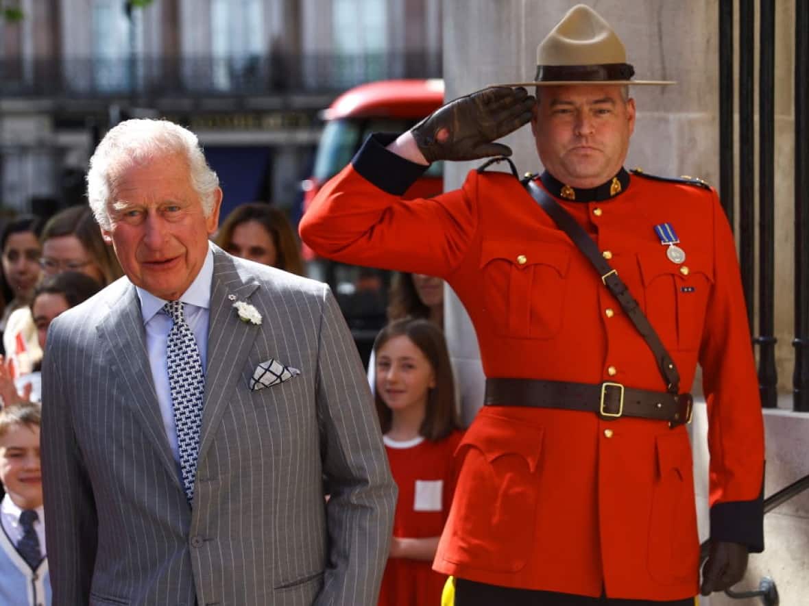 A Mountie salutes as Prince Charles visits Canada House in London, England, on May 12, 2022. The coronation for King Charles takes place on Saturday in Westminster Abbey in London. (Hannah McKay/Getty Images - image credit)