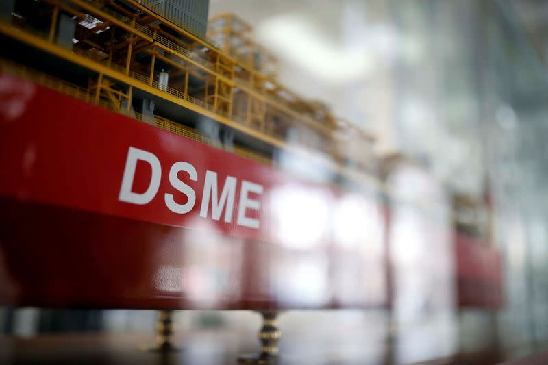 FILE PHOTO: The name of Daewoo Shipbuilding & Marine Engineering Co is seen on a replica ship displayed at its building in Seoul, South Korea