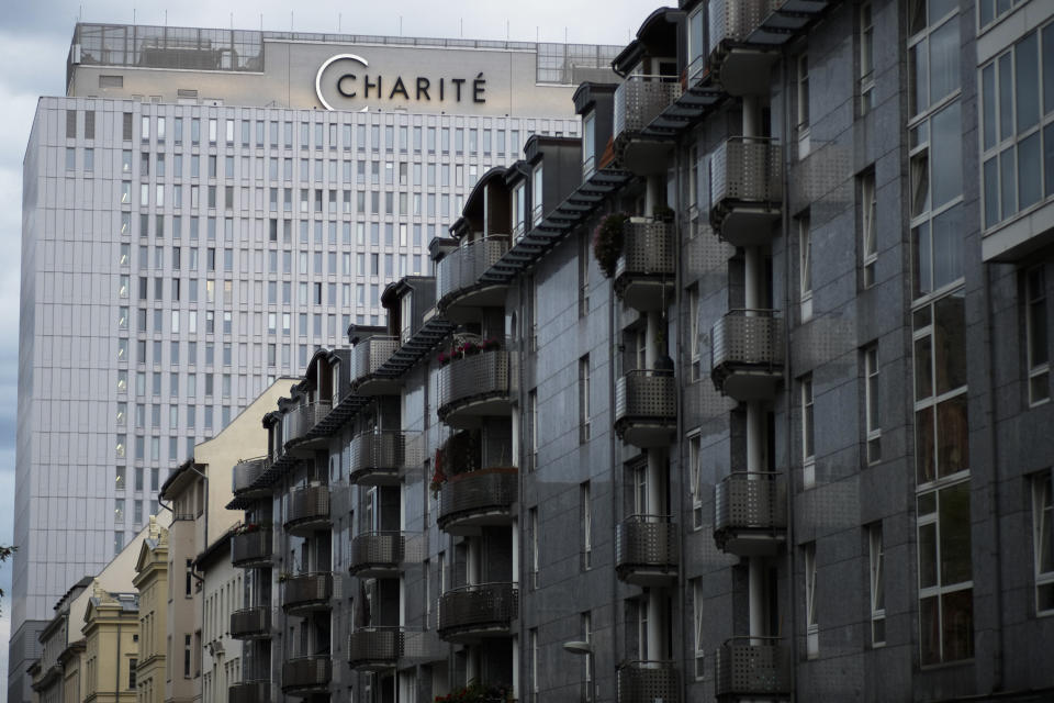 The central building of Charite Hospital, where Russian dissident Alexei Navalny is being treated in Berlin, Germany, Monday, Aug. 24, 2020. The German hospital treating Russian dissident Alexei Navalny says tests indicate that he was poisoned, according to a statement Monday, saying that the team of doctors who have been examining Navalny since he was admitted Saturday have found the presence of "cholinesterase inhibitors" in his system. Cholinesterase inhibitors are a broad range of substances that are found in several drugs, but also pesticides and nerve agents.(AP Photo/Markus Schreiber)