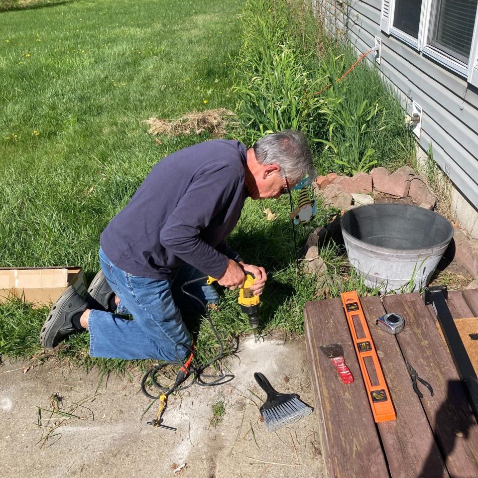 A St. Joseph's Helpers volunteer works in a client's home.