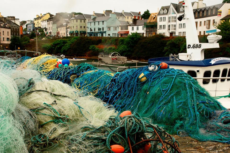 A Bright Tangle of Fishing nets and boys and ropes, B and B's and Pubs along the harbor, Roundstone Ireland