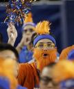 A Florida fan cheers before an NCAA Final Four tournament college basketball semifinal game against Connecticut, Saturday, April 5, 2014, in Arlington, Texas. (AP Photo/David J. Phillip)