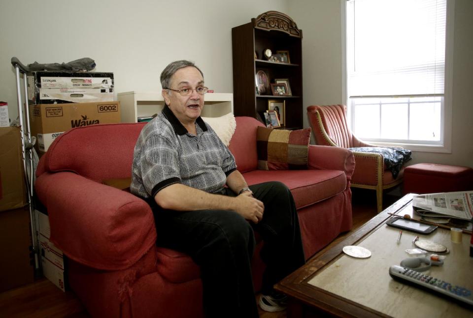 Howard Kraft discusses signing up for health insurance as he sits in his Lincolnton, N.C. home Monday, Dec. 30, 2013. All things good, bad and unpredictable converge Jan. 1 for President Barack Obama’s health care overhaul as the law’s major benefits take effect, along with an unpopular insurance mandate and a real risk of more nerve-wracking disruptions to coverage. For some, the changes bring big improvements, including Kraft. A painful spinal problem left him unable to work as a hotel bellman. But he’s got coverage because federal law now forbids insurers from turning away people with health problems. “I am not one of these people getting a policy because I’m being made to,” Kraft said. “I need one to stay alive.”(AP Photo/Nell Redmond)