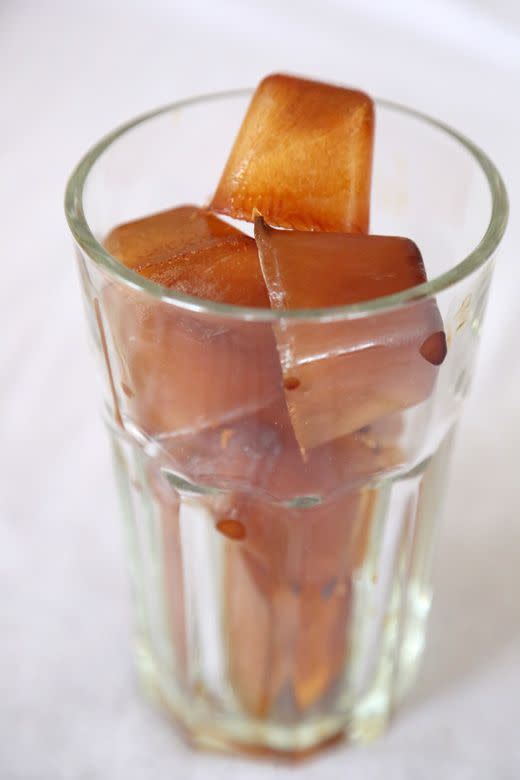 <p>Pour coffee into ice cube trays and freeze overnight. In the morning, put them in a glass and fill it with milk for a quick and easy iced coffee. </p><p>Get the tutorial from <a href="http://rabbitfoodformybunnyteeth.com/the-best-iced-coffee/" rel="nofollow noopener" target="_blank" data-ylk="slk:Rabbit Food for my Bunny Teeth;elm:context_link;itc:0;sec:content-canvas" class="link ">Rabbit Food for my Bunny Teeth</a>.</p>