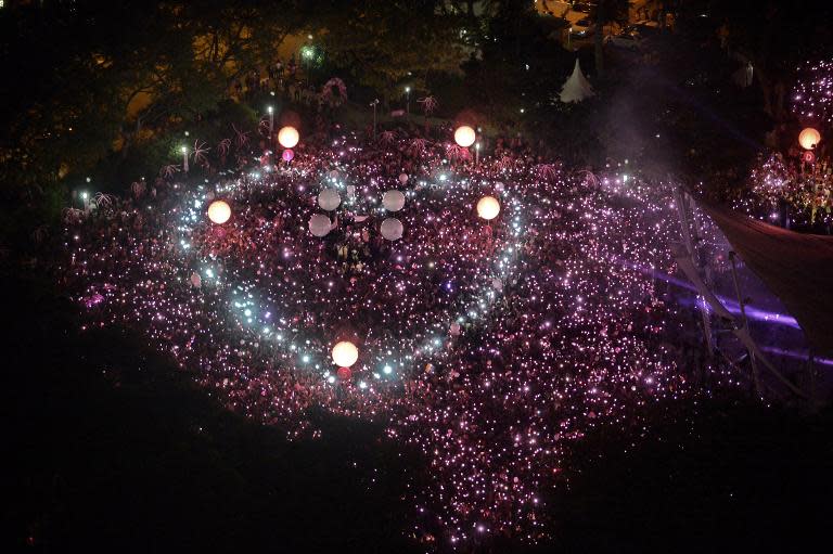 Gay rights supporters celebrate sexual diversity at a rally in Singapore on June 28, 2014