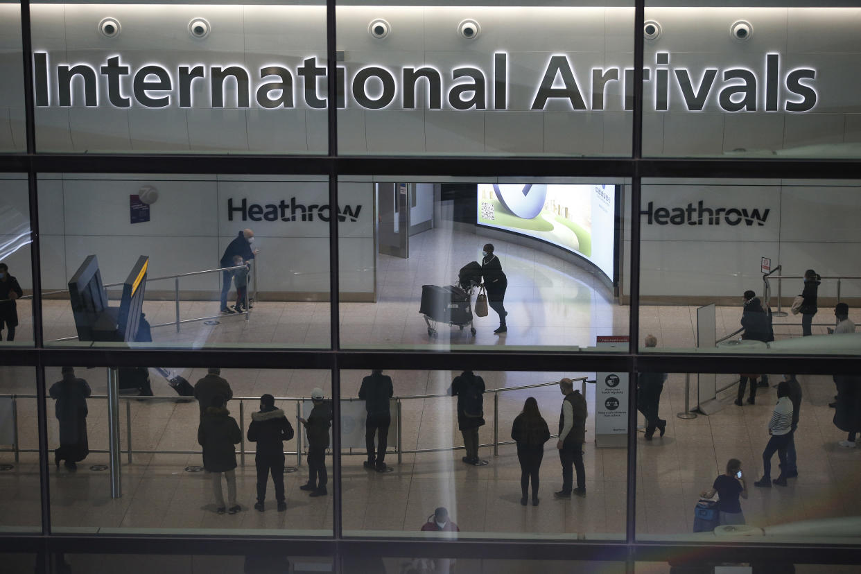 <p>Travellers at Heathrow on Sunday</p> (Getty)