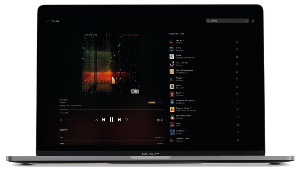 Tidal's playback and queue interface displayed on a MacBook Pro laptop