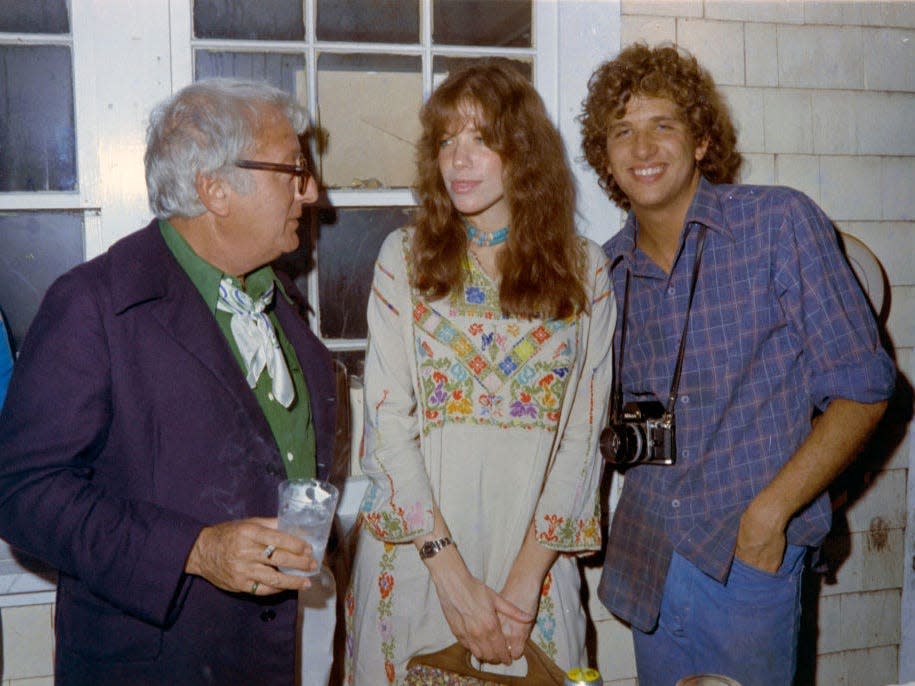 Jerry Mason, Carly Simon, and Peter Simon attend a party in the Hamptons
