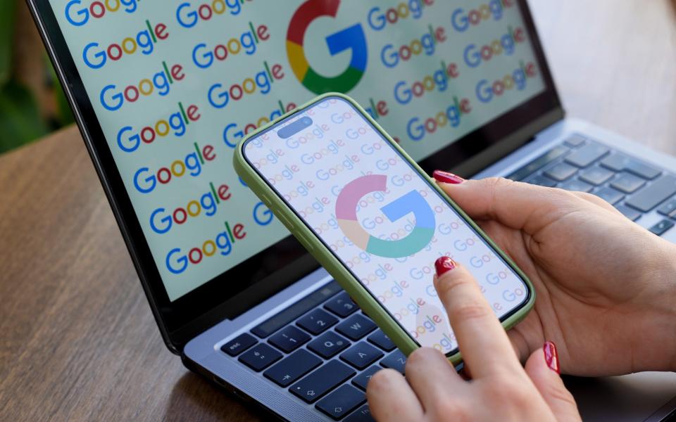 Google logo on a phone and a laptop