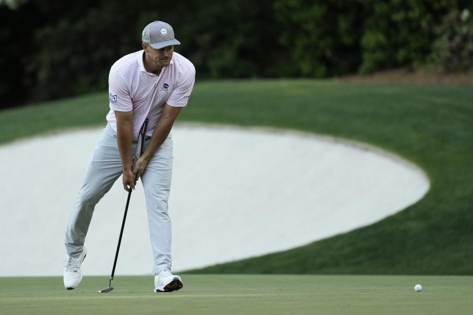 Bryson DeChambeau reacts after missing a putt on the 13th hole during third round at the Masters golf tournament at Augusta National Golf Club Saturday, April 13, 2024, in Augusta, Ga. (AP Photo/Charlie Riedel)