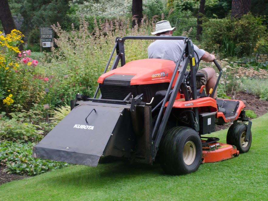 Landscaping lawn mower summer yard flowers