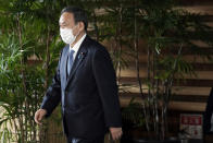 Former Chief Cabinet Secretary Yoshihide Suga walks out of the prime minister's office after a cabinet meeting Wednesday, Sept. 16, 2020, in Tokyo. Prime Minister Shinzo Abe and his Cabinet resigned, clearing the way for his successor Suga to take over after parliamentary confirmation later Wednesday. (AP Photo/Eugene Hoshiko)