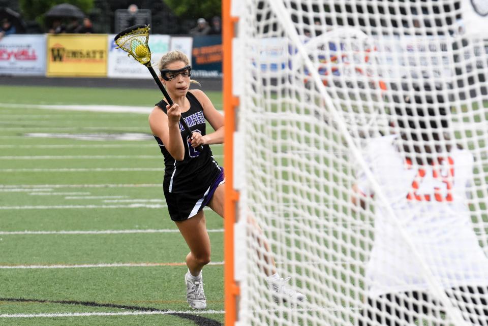 Bloomfield Hills' Rachel Shepard takes a shot against Brighton during a Division 1 state semifinal lacrosse game on Wednesday, June 8, 2022 at Brighton.