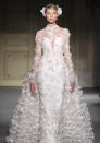 <b>Georges Hobieka SS13</b> <br><br>Romantic, flower-embellished dresses made for a dream-like show.<br><br>© Rex