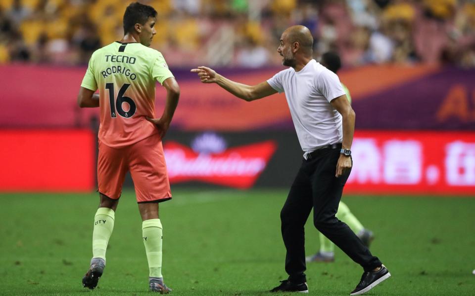 Pep Guardiola (derecha) Rodri (izquierda) - - Getty Images/Yifan Ding