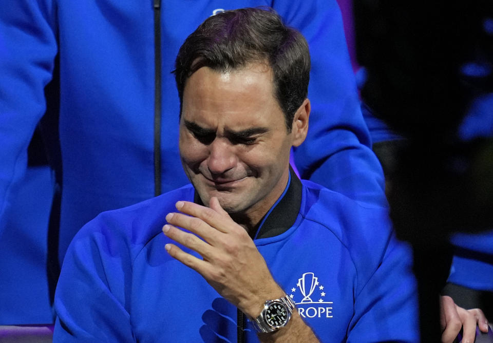 An emotional Roger Federer of Team Europe sits alongside his playing partner Rafael Nadal after their Laver Cup doubles match against Team World's Jack Sock and Frances Tiafoe at the O2 arena in London, Friday, Sept. 23, 2022. Federer's losing doubles match with Nadal marked the end of an illustrious career that included 20 Grand Slam titles and a role as a statesman for tennis. (AP Photo/Kin Cheung)