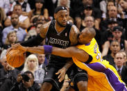 MIAMI, FL - JANUARY 19: LeBron James #6 of the Miami Heat is guarded by Kobe Bryant #24 of the Los Angeles Lakers during a game at American Airlines Arena on January 19, 2012 in Miami, Florida. NOTE TO USER: User expressly acknowledges and agrees that, by downloading and/or using this Photograph, User is consenting to the terms and conditions of the Getty Images License Agreement. (Photo by Mike Ehrmann/Getty Images)