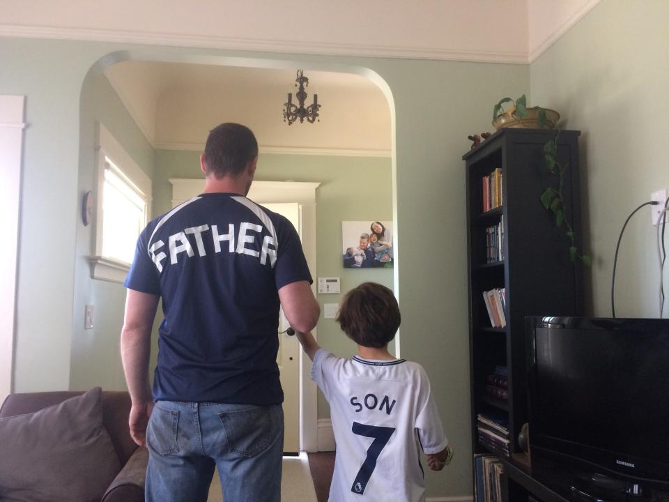 Aimee Phan's husband and son wearing their Tottenham Hotspur jerseys in 2019.