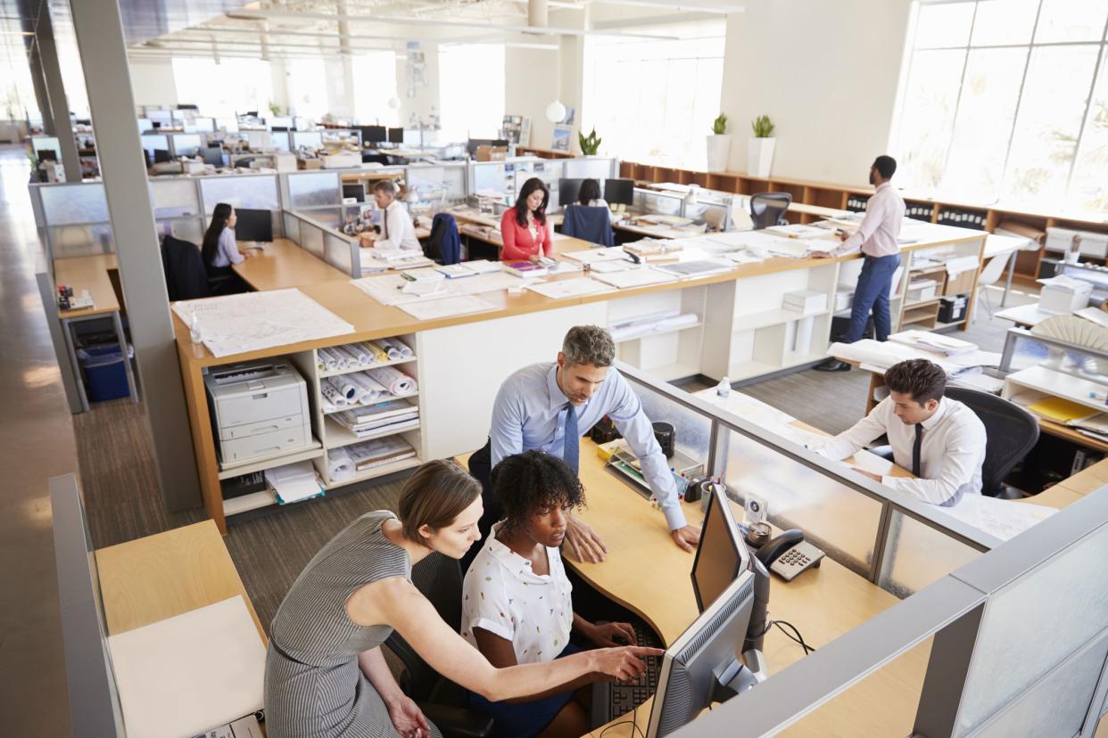 Colleagues working at a womanâ