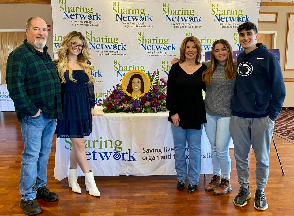 The family Hailey Palumbo at the Jackson Township Fire Department for the unveiling of a floragraph tribute to Hailey that will be featured on a Rose Parade float. Pictured left to right are Ray Wetstein, Hailey’s stepfather; Morgan Palumbo, Hailey’s sister; Janet Palumbo, Hailey’s mother; Ashley Wetstein, Hailey’s stepsister; and Nicholas Wetstein, Hailey’s stepbrother.