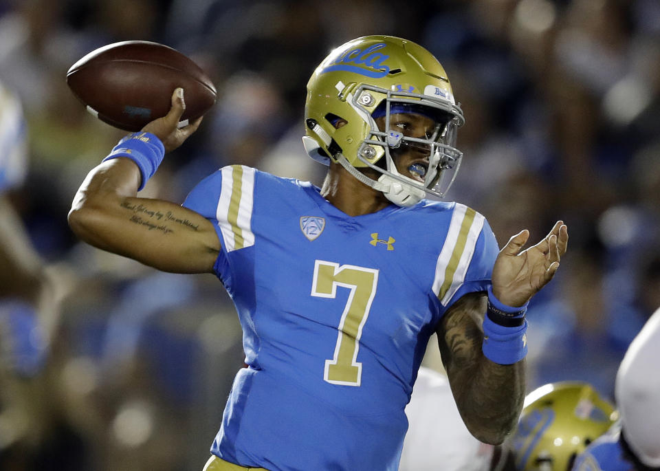 FILE - UCLA quarterback Dorian Thompson-Robinson throws against Fresno State during the first half of an NCAA college football game Saturday, Sept. 15, 2018, in Pasadena, Calif. If the Bruins are going to contend for the Pac-12 title, it will need big seasons again from quarterback Dorian Thompson-Robinson and running back Zach Charbonnet. UCLA opens the season on Sept. 4 against Bowling Green. (AP Photo/Marcio Jose Sanchez, File)