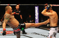 ATLANTA, GA - APRIL 21: Travis Browne (L) kicks Chad Griggs during their heavyweight bout for UFC 145 at Philips Arena on April 21, 2012 in Atlanta, Georgia.