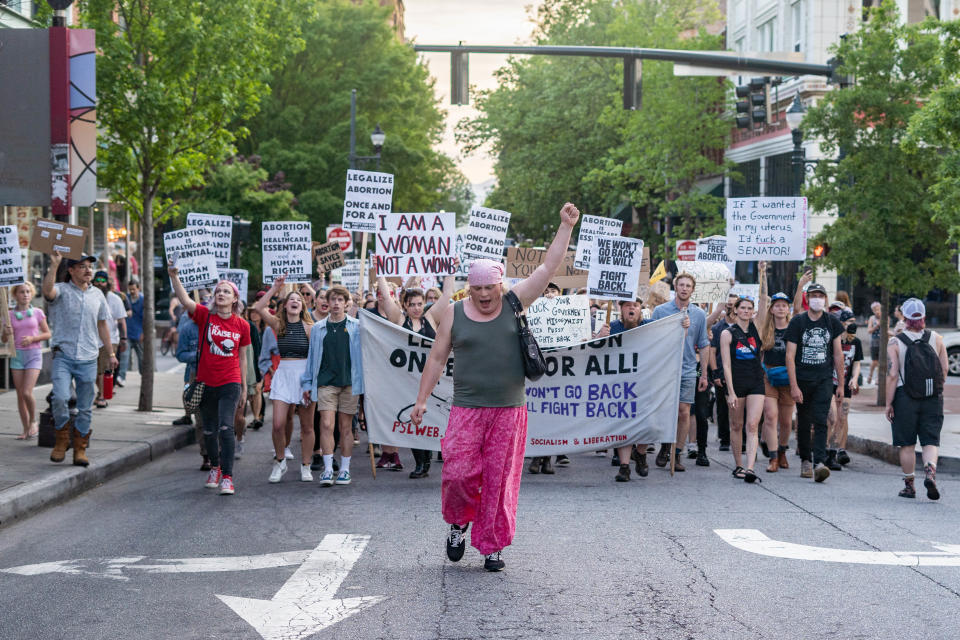 Abortion rights supporters gather in Asheville on May 3, 2022, following news that a then-proposed US Supreme Court ruling would overturn the 1973 Roe vs. Wade decision that legalized abortion nationwide.