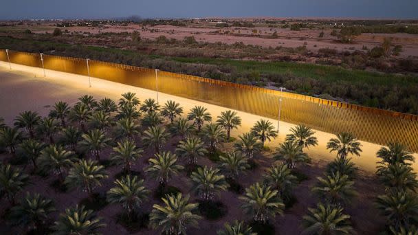 PHOTO: FILE - In this aerial view, a date farm stands next to a section of the U.S.-Mexico border fence built by the Trump Administration, Sept. 27, 2022 in Yuma, Arizona. (John Moore/Getty Images, FILE)