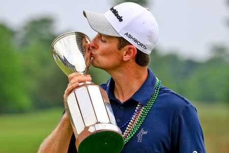 Justin Rose kisses the Zurich Classic championship trophy following his win in the final round of the Zurich Classic at TPC Louisiana. Derick E. Hingle-USA TODAY Sports