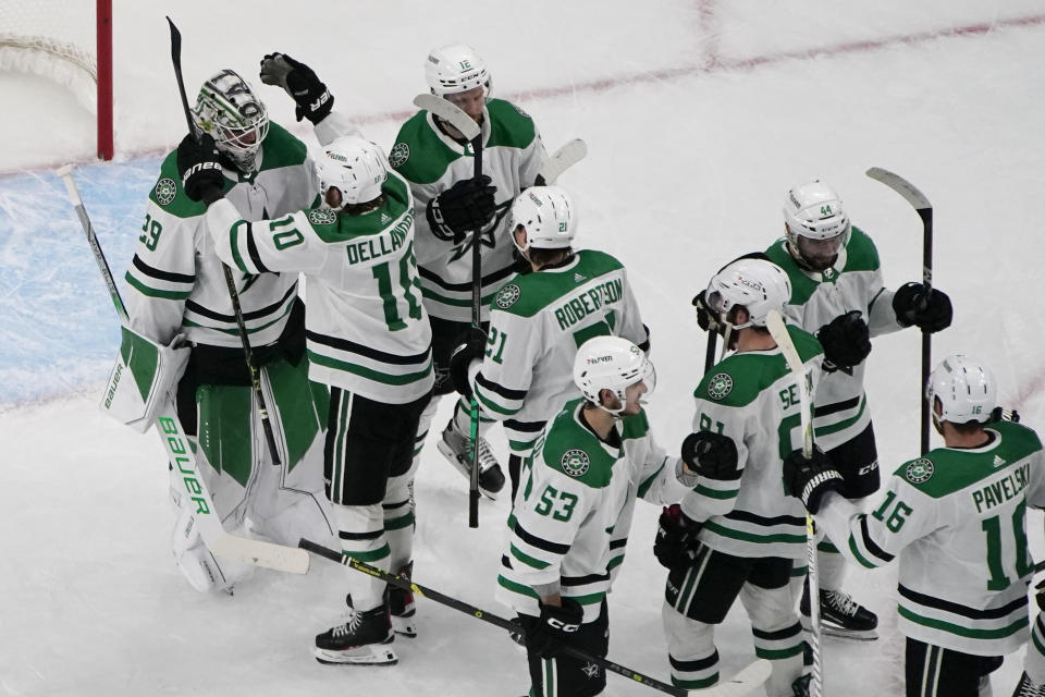 Dallas Stars celebrate after defeating the Vegas Golden Knights in Game 5 of the NHL hockey Stanley Cup Western Conference finals Saturday, May 27, 2023, in Las Vegas. (AP Photo/John Locher)