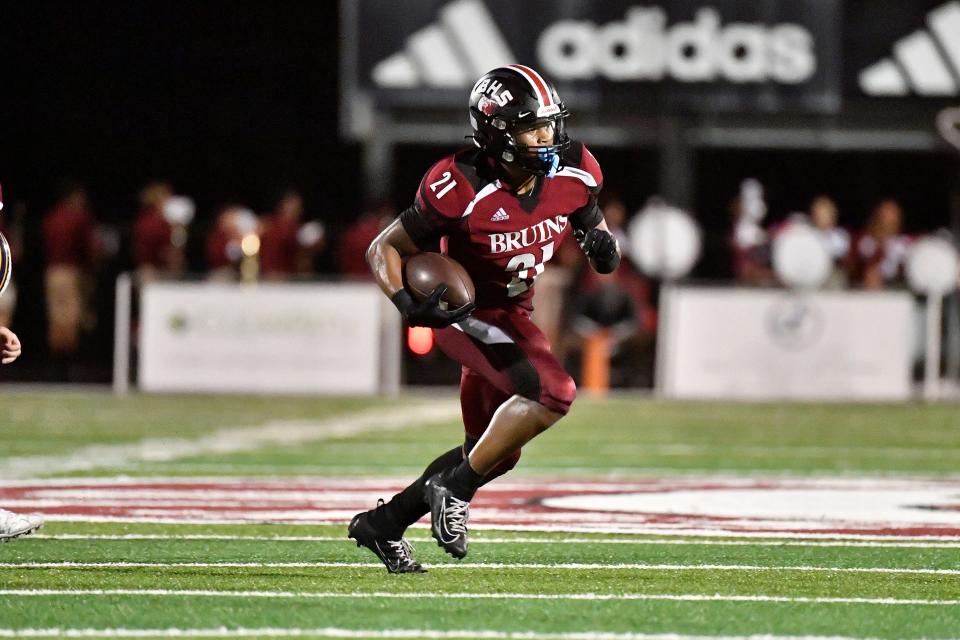 Ballard's running back Journey Wyche (21) breaks into the open field to score a touchdown during the first half of their game against Franklin County at Ballard High School, Friday, Sept. 9 2022 in Louisville Ky.