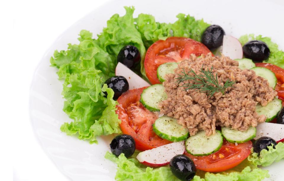 close up of tuna salad,high angle view of food in plate on white background,moldova