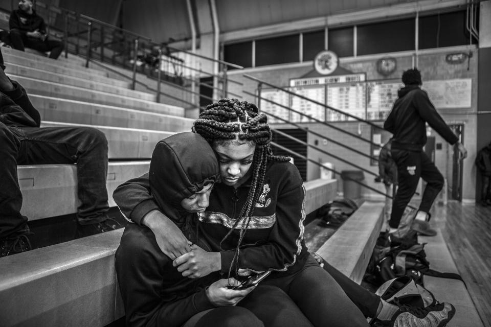 In this image released by World Press Photo, Thursday April 15, 2021, by Chris Donovan, part of a series titled Those Who Stay Will Be Champions which won first prize in the Sports Stories category, shows Jaguars player D'Angelo Mays plays with a basketball in his bedroom at home, on Feb. 27, 2020. (Chris Donovan, World Press Photo via AP)