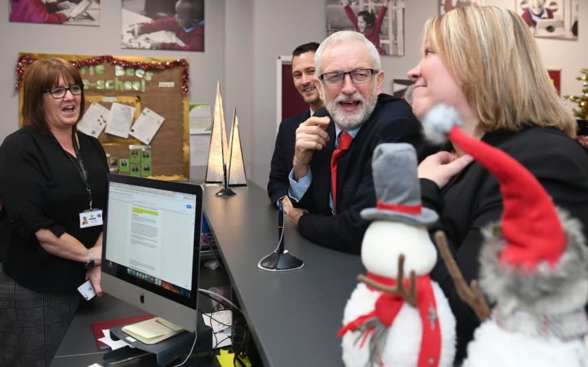 Class clown: Jeremy Corbyn enjoys a campaign visit to a school in Peterborough - PA