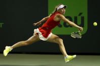 Mar 28, 2017; Miami, FL, USA; Caroline Wozniacki of Denmark reaches for a backhand against Lucie Safarova of the Czech Republic (not pictured) on day eight of the 2017 Miami Open at Crandon Park Tennis Center. Mandatory Credit: Geoff Burke-USA TODAY Sports