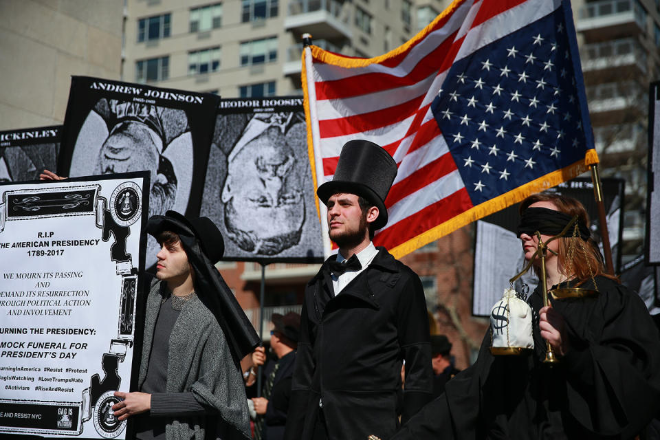 <p>Protesters dressed as Abraham Lincoln and the Lady Justice demonstrate at the “Mock Funeral for Presidents’ Day” rally at Washington Square Park in New York City on Feb. 18, 2017. (Gordon Donovan/Yahoo News) </p>