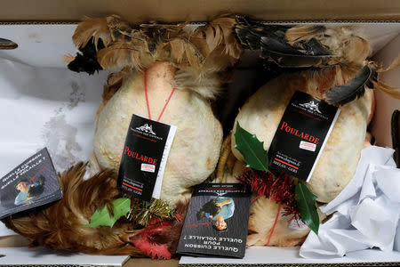 Fattened capons are pictured at the poultry pavilion in the Rungis International wholesale food market as buyers prepare for the Christmas holiday season in Rungis, south of Paris, France, November 30, 2017. Picture taken November 30, 2017. REUTERS/Benoit Tessier