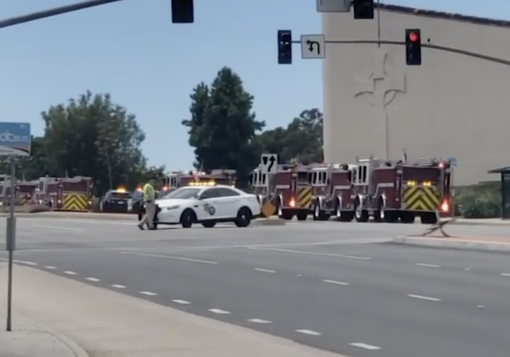 Police and fire department vehicles outside of a church in Laguna Woods, California, where one person was killed and five were injured in a shooting. (Screen grab of ABC7 newscast)