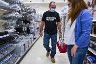 Robert Duboise shops at Target with his attorney, Susan Friedman, on Friday, Sept. 11, 2020 in Tampa. The Florida man who spent the last 37 years in prison on a rape and murder charge was freed from prison after officials discovered dramatic new evidence that proved his innocence. (Martha Asencio Rhine/Tampa Bay Times via AP)