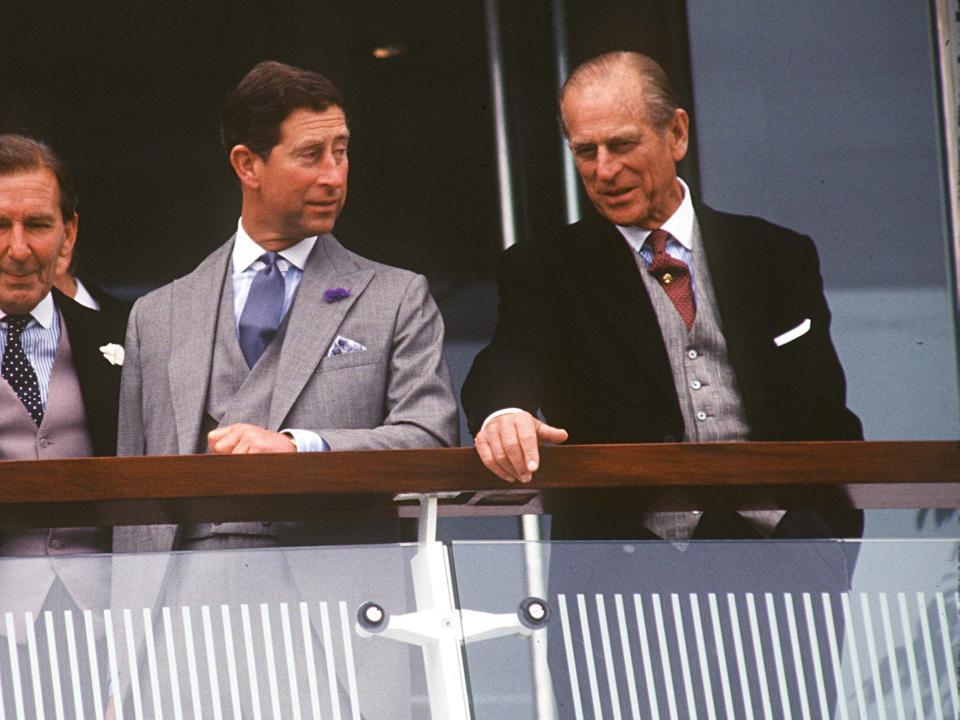 Prince Charles and Prince Philip watch races at the Derby