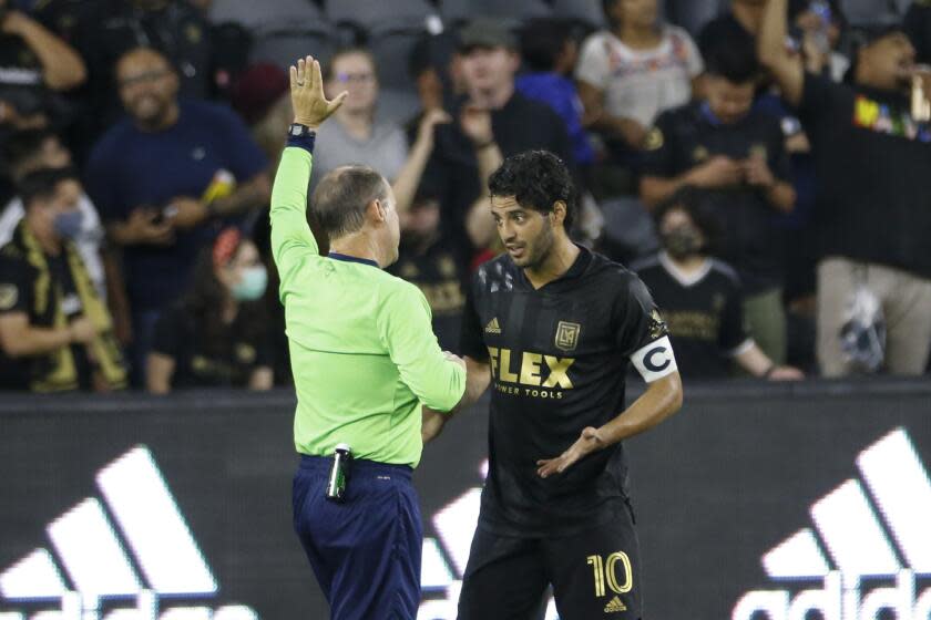 Los Angeles FC forward Carlos Vela (10) argues with a referee during an MLS soccer match between the Los Angeles FC and the Vancouver Whitecaps in Los Angeles, Saturday, July 24, 2021. (AP Photo/Ringo H.W. Chiu)