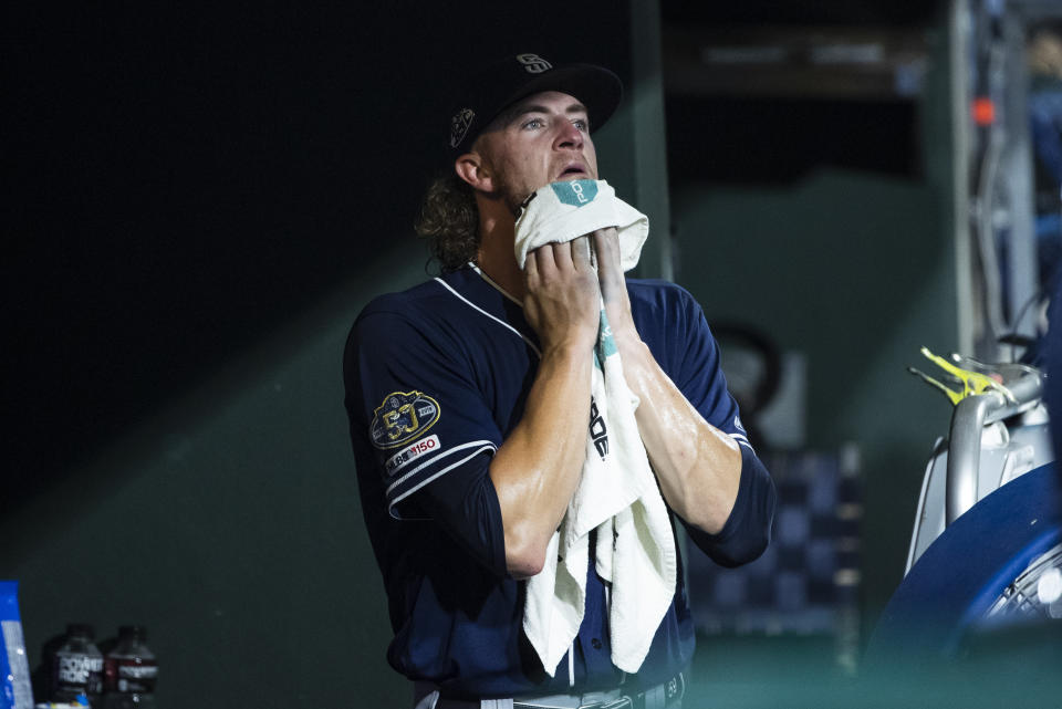 San Diego Padres starting pitcher Chris Paddack wipes his face after being removed during the fifth inning of the team's baseball game against the Philadelphia Phillies on Friday, Aug. 16, 2019, in Philadelphia. (AP Photo/Matt Rourke)