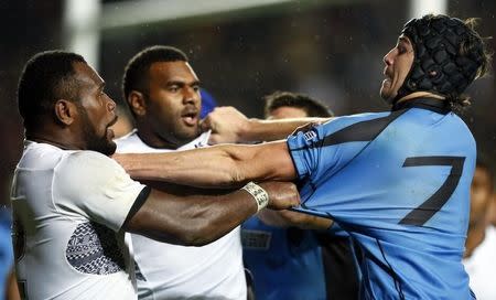 Rugby Union - Uruguay v Fiji - IRB Rugby World Cup 2015 Pool A - Stadium MK, Milton Keynes, England - 6/10/15 Uruguay's Matias Beer clashes with Fiji's Peni Ravai Kovekalou Reuters / Stefan Wermuth Livepic