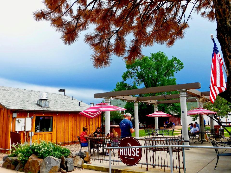 Stormy skies can’t chase diners off the patio from The House restaurant in Show Low.